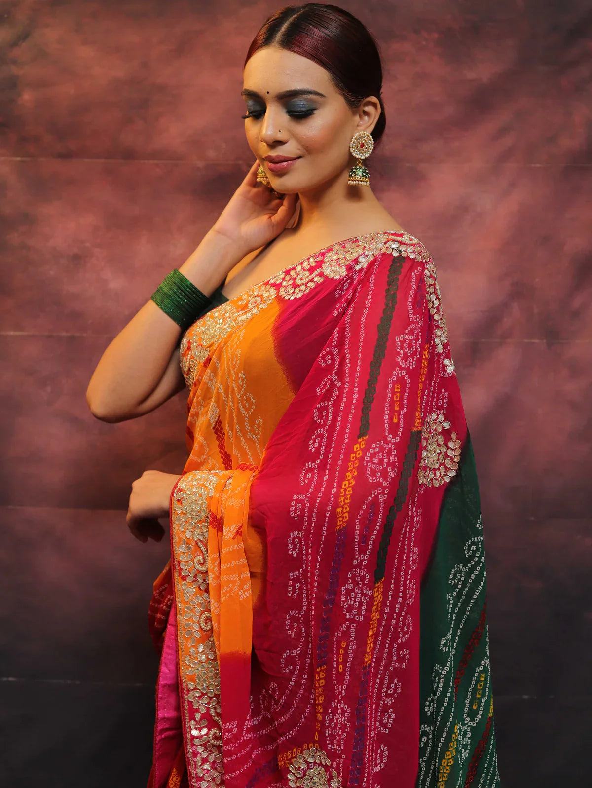 A Symphony of Colors and Craftsmanship: The Chiffon Bandhej Saree with Gotapatti Zardozi Work